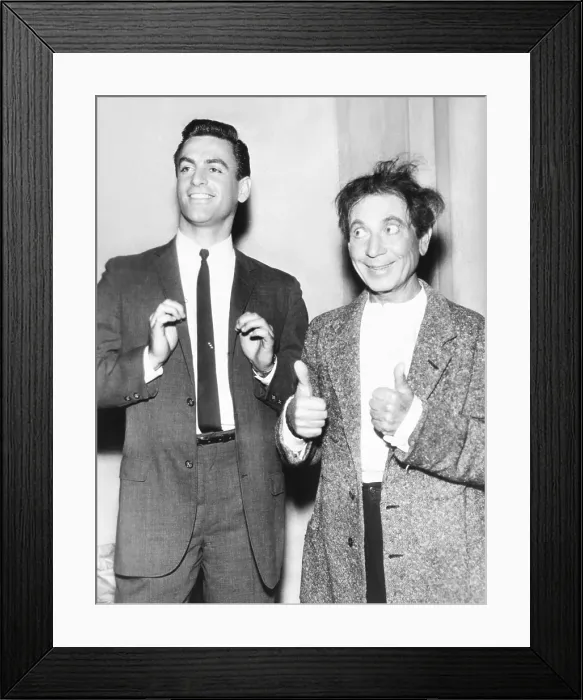 Framed Print : Harpo Marx gives a double thumbs up for his son, Bill. Jan 1961. Harpo and his wife actress Susan Fleming adopted four children: Bill, Alex, Jimmy, and Minnie
