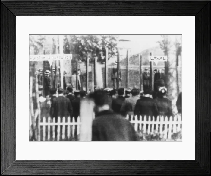 Framed Print : Execution of Pierre Laval on Oct. 17, 1945. The firing squad is at left, and Laval is at right, in the courtyard of Frennes Prison Framed Print : Execution of Pierre Laval on Oct. 17, 1945. The firing squad is at left, and Laval is at right, in the courtyard of Frennes Prison