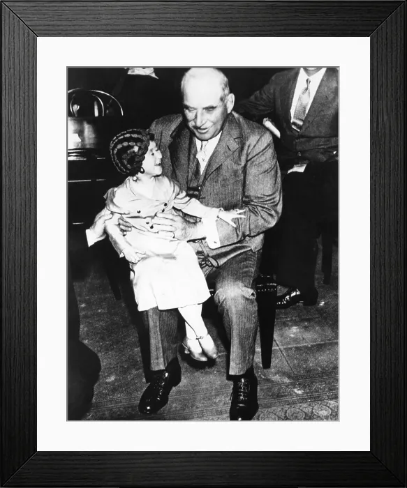 Framed Print : Financier J.P. Morgan with circus midget Lya Graf sitting on his knee, June 1, 1933