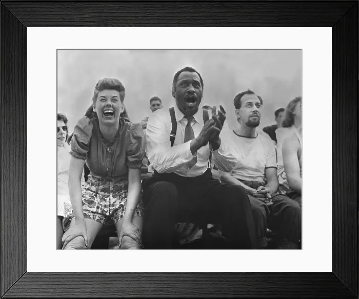 Framed Print : New York City, Paul Robeson (center), Jose Ferrer (right), watching softball with other members of Othello production, Central Park, circa 1943-1944 Framed Print : New York City, Paul Robeson (center), Jose Ferrer (right), watching softball with other members of Othello production, Central Park, circa 1943-1944