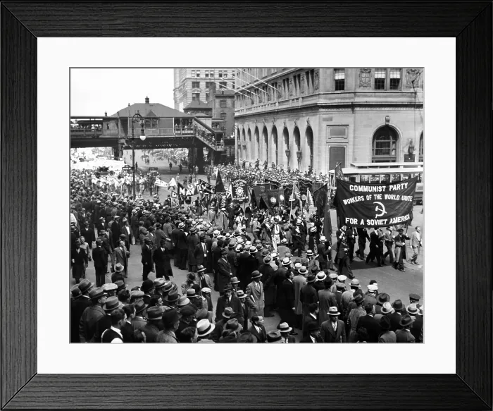 Framed Print : Reds gather for 1934 May Day parade to Union Square in New York City. The procession is lead by a large banner reading, Communist Party. Workers of the World Unite