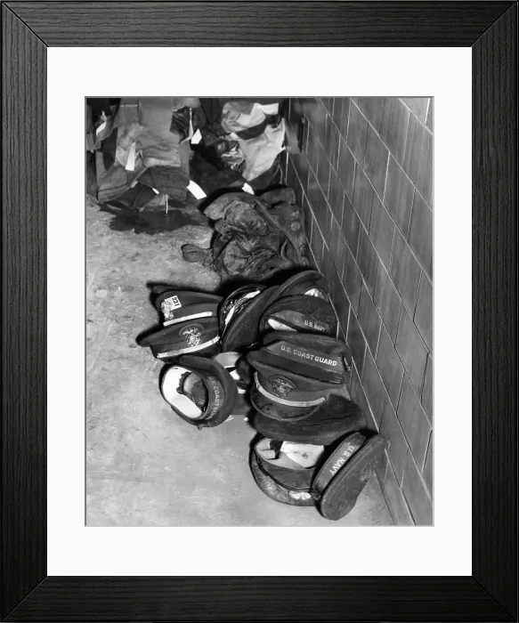 Framed Print : Coconut Grove Nightclub Fire. Service men's hats aided identification of those who were burned beyond recognition in the Nov. 28, 1942 fire that killed 492 and injured 214