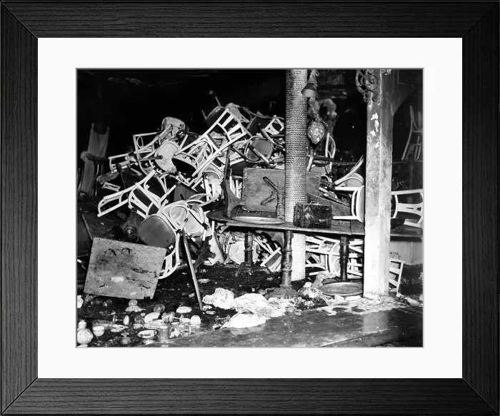 Framed Print : Coconut Grove Nightclub Fire. Charred tables and chairs, broken glass and other debris in the fire-ruined interior of the Coconut Grove nightclub