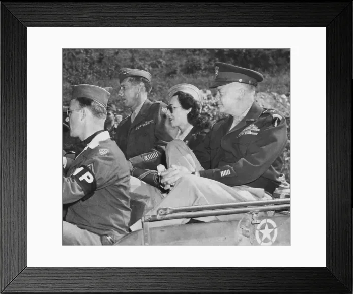 Framed Print : Kay Summersby seated between Generals Eisenhower and Mark Clark in a Jeep. They were in Germany, passing the ruins of Hitler's Berchtesgaden retreat Framed Print : Kay Summersby seated between Generals Eisenhower and Mark Clark in a Jeep. They were in Germany, passing the ruins of Hitler's Berchtesgaden retreat
