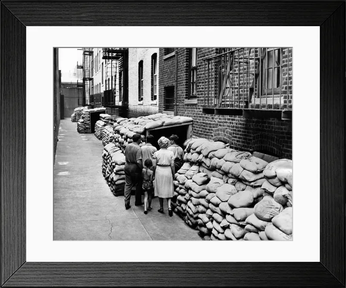 Framed Print : Exterior view of the first large air raid shelter on New York City's Lower East Side. It was half a block long and is protected by 4, 000 sandbags. July 13, 1942