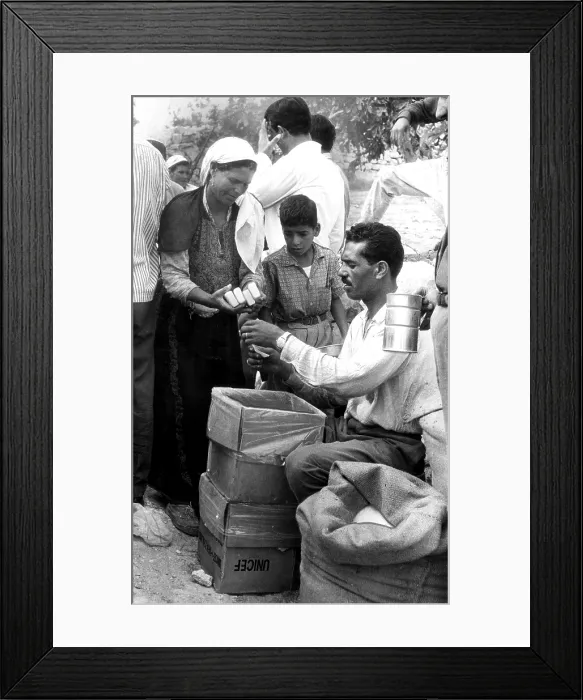 Framed Print : JERUSALEM: Soap is given to refugees at a distribution point set up for UNICEF supplies sent to relieve destitute families in Jordan Framed Print : JERUSALEM: Soap is given to refugees at a distribution point set up for UNICEF supplies sent to relieve destitute families in Jordan