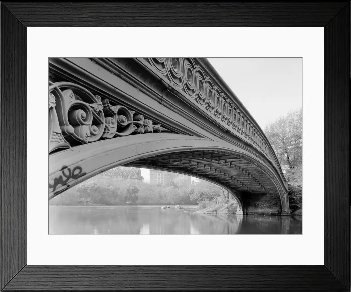Framed Print : New York City, Central Park's Bow Bridge, view showing underside of arch, the Dakota Apartment building is visible to the left, photograph by Jet Lowe, circa 1980s