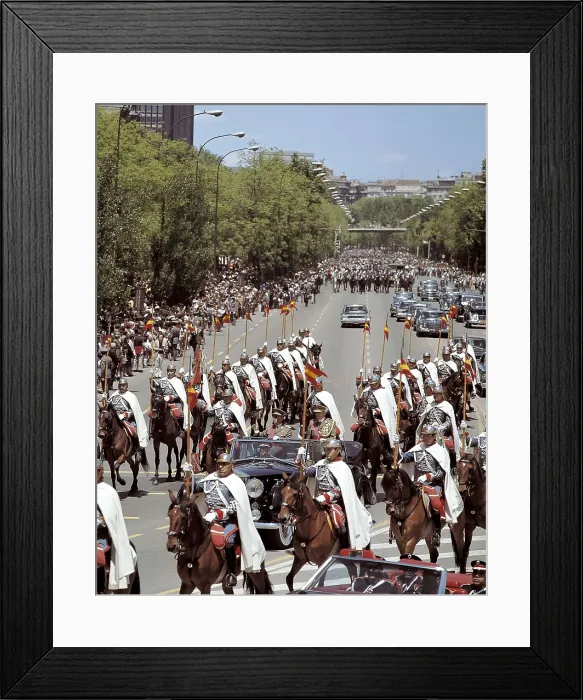 Framed Print : Francisco Franco going for a drive through the Paseo de la Castellana in Madrid after presiding the Parade of the Victory. He is with the Minister of the Army, Juan Castaon