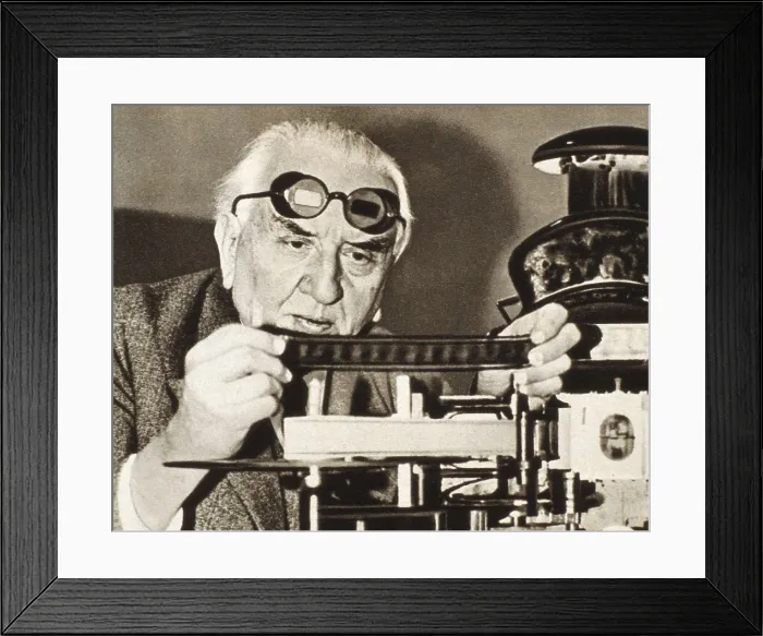 Framed Print : LUMIRE, Auguste (1862-1954). Lumire before his machine for film showing in relief. AISA / Everett Collection**US SALES ONLY** Framed Print : LUMIRE, Auguste (1862-1954). Lumire before his machine for film showing in relief. AISA / Everett Collection**US SALES ONLY**