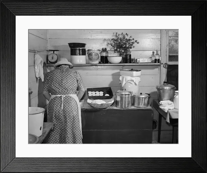 Framed Print : Mary Wilkins baking biscuits for dinner on cornshucking day near Tallyho, photograph by Marion Post Wolcott, North Carolina, September, 1939