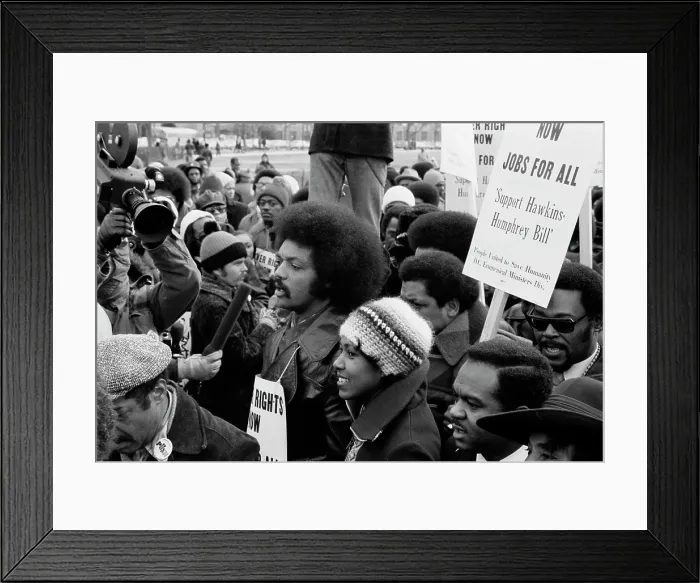 Framed Print : Reverend Jesse Jackson (center, second row), leads a march for jobs around the White House, protesters carry signs advocating support for the Hawkins-Humphrey Bill for employment