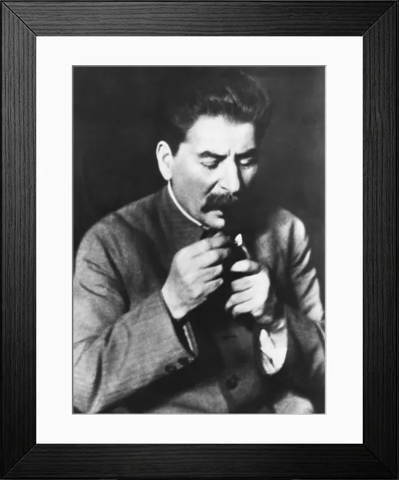 Framed Print : Josef Stalin head of the Communist Party of the Soviet Union lighting his pipe. May 10, 1935. (CSU_2015_11_1378)