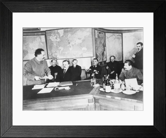 Framed Print : Josef Stalin (seated, right) is shown a 13.787 kilogram gold nugget by G.K. Orjonikioze. Jan 29, 1936, Moscow. The nugget was found at the Uralzoloto fields