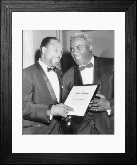 Framed Print : Light heavyweight champion Archie Moore talks with ex-baseball star Jackie Robinson (right).They were at the Lighthouse Sports World Dinner