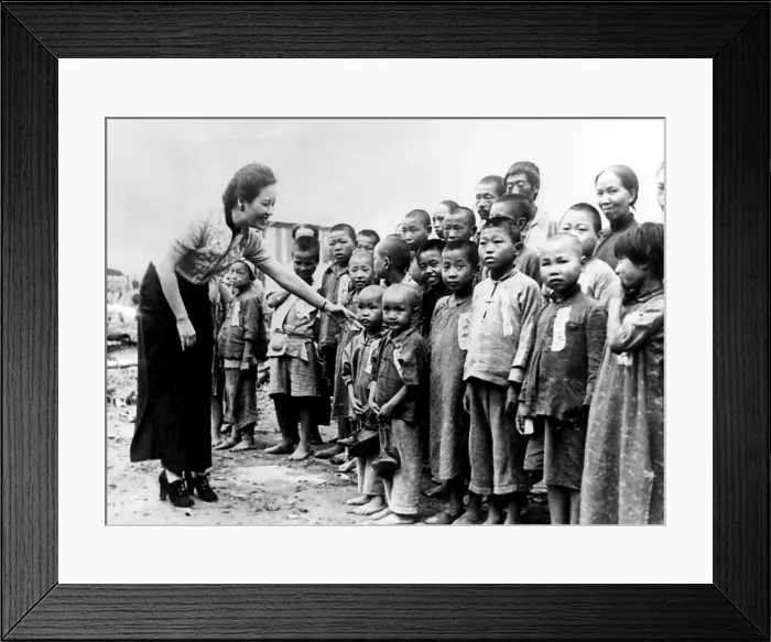 Framed Print : Soong Mei-ling, wife of General Chiang Kai-shek, greets some of the 200 orphans she adopted in Chungking, China Framed Print : Soong Mei-ling, wife of General Chiang Kai-shek, greets some of the 200 orphans she adopted in Chungking, China