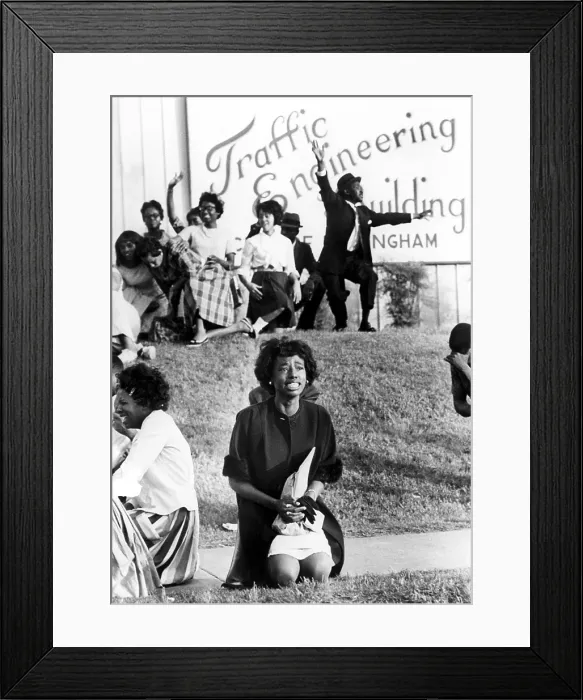 Framed Print : Birmingham, Alabama: A young woman kneels in prayer on sidewalk outside city traffic engineering building, 5 / 5 / 63, during anti-segregation protest demonstration Framed Print : Birmingham, Alabama: A young woman kneels in prayer on sidewalk outside city traffic engineering building, 5 / 5 / 63, during anti-segregation protest demonstration