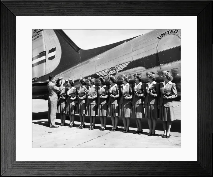 Framed Print : Don F. Magarrell gives new United Airlines stewardesses their wings. The national defense business caused a growth in air traffic, 1941. Courtesy: CSU Archives / Everett Collection