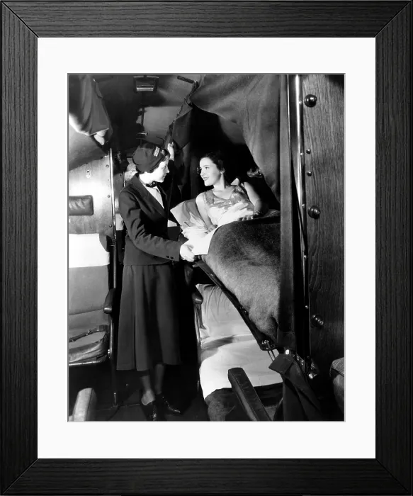 Framed Print : American Airlines stewardess checks on passenger in sleeper airplane, 1935. Courtesy: CSU Archives / Everett Collection Framed Print : American Airlines stewardess checks on passenger in sleeper airplane, 1935. Courtesy: CSU Archives / Everett Collection