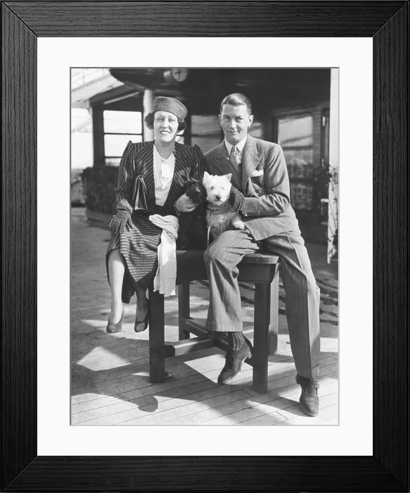 Framed Print : Gloria Swanson with her husband, Michael farmer, her 4th husband. March 16, 1933. They arrived in NYC after she produced the English film, PERFECT UNDERSTANDING Framed Print : Gloria Swanson with her husband, Michael farmer, her 4th husband. March 16, 1933. They arrived in NYC after she produced the English film, PERFECT UNDERSTANDING