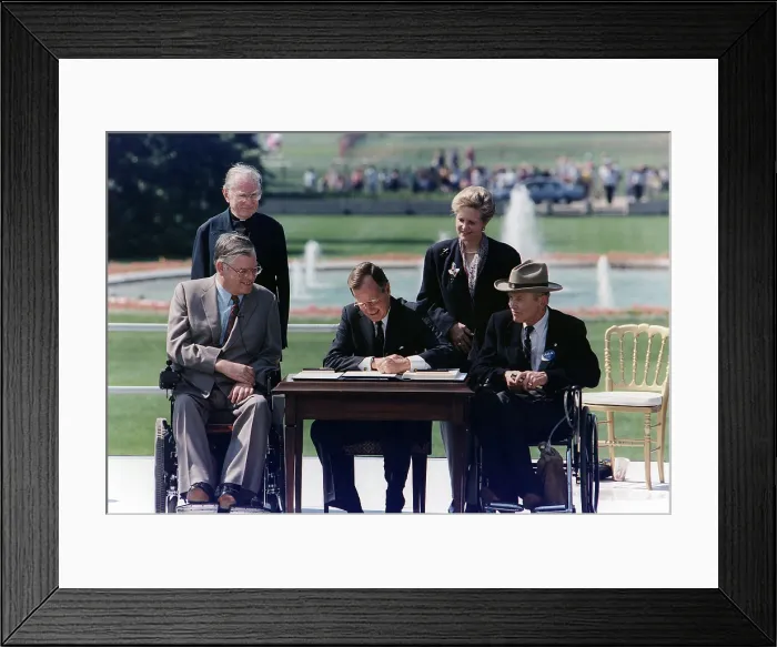 Framed Print : President Bush signs into law the Americans with Disabilities Act of 1990 on the South Lawn of the White House. Washington, D.C. January 20, 1993