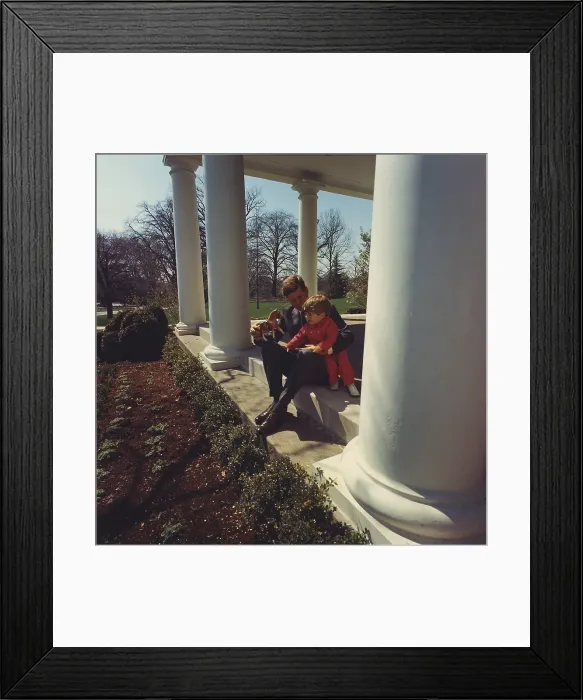Framed Print : President John Kennedy plays with son John Jr. at the West Wing of the White House. 1962