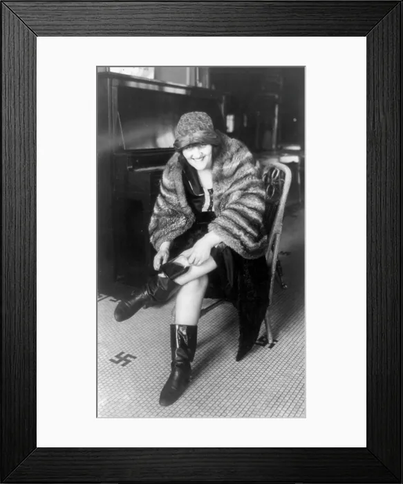 Framed Print : Prohibition, a woman putting a flask in her Russian boot, Washington DC, 1922
