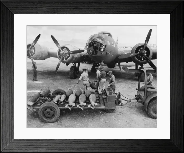 Framed Print : An ordnance crew loading 300 pound bombs into a U.S. Air Force bomber, Hawaii, 1942.. Courtesy: CSU Archives / Everett Collection Framed Print : An ordnance crew loading 300 pound bombs into a U.S. Air Force bomber, Hawaii, 1942.. Courtesy: CSU Archives / Everett Collection
