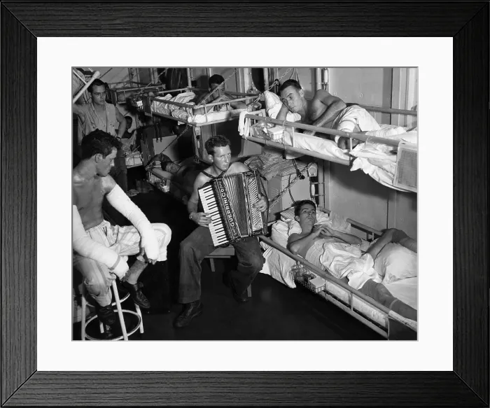 Framed Print : Coast Guard sailors wounded in the Southwest Pacific are entertained by an accordian player, 1945.. Courtesy: CSU Archives  /  Everett Collection