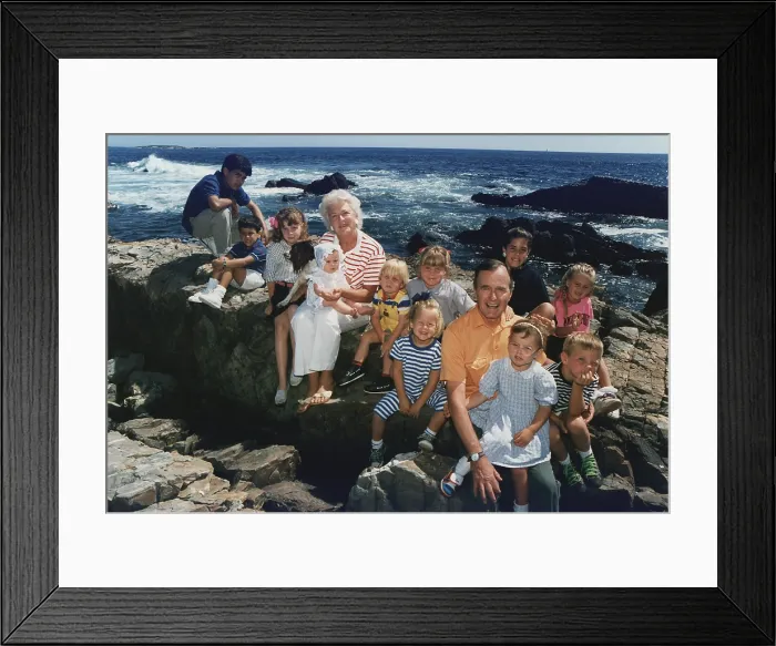 Framed Print : President George H. W. Bush and wife Barbara pose with twelve of their grandchildren and family dog, Millie, on the rocks at Walker's Point in Kennebunkport, Maine. Ca. 1989 Framed Print : President George H. W. Bush and wife Barbara pose with twelve of their grandchildren and family dog, Millie, on the rocks at Walker's Point in Kennebunkport, Maine. Ca. 1989