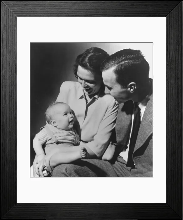 Framed Print : The future 41st U.S. President, George H. W. Bush and wife Barbara with their first born child, the future 43rd president, George Walker Bush, while Bush Sr Framed Print : The future 41st U.S. President, George H. W. Bush and wife Barbara with their first born child, the future 43rd president, George Walker Bush, while Bush Sr