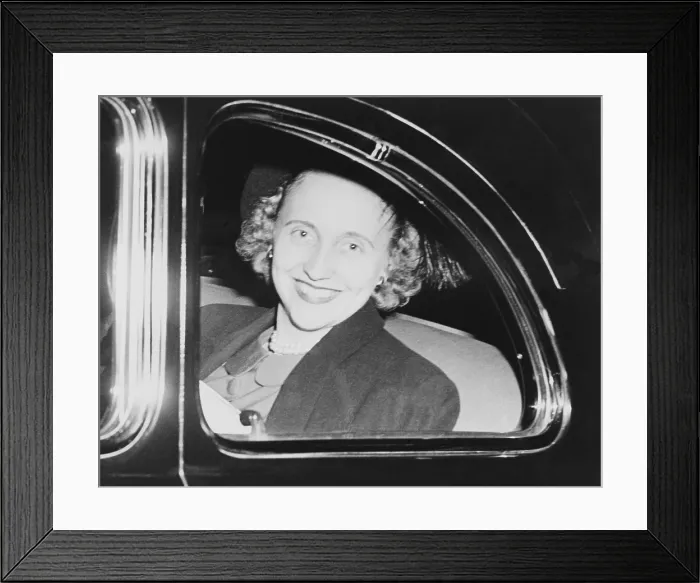 Framed Print : Margaret Truman, looking out the window of an automobile as she returns to Washington after a trip to Florida with her parents, President and Mrs. Harry S. Truman. Ca. 1948