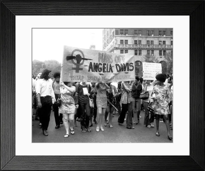 Framed Print : Women's Liberation marchers carrying a banner in support of fugitive black militant Angela Davis, New York City, 08-26-1970. Courtesy: CSU Archives  /  Everett Collection