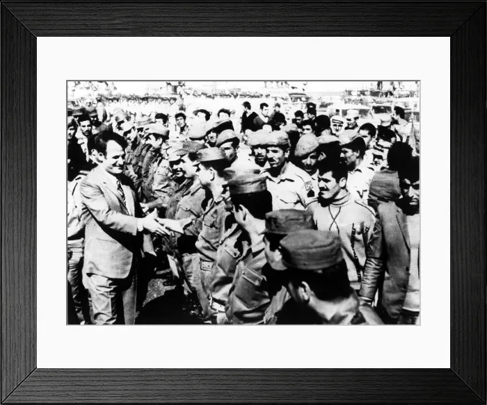 Framed Print : 10 / 19 / 71--DERAA, SYRIA: Syrian President Hafez Assad (left) shakes hands with Syrian troops near the Syrian-Israeli border. In a speech in the town