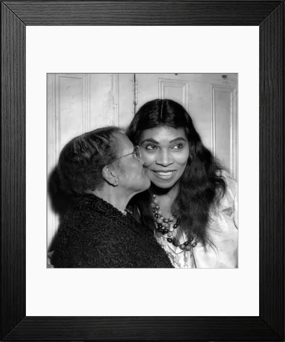 Framed Print : Anna Anderson kisses her daughter, singer Marian Anderson, after a performance of Verdi's The Masked Ball at the Metropolitan Opera, 1955