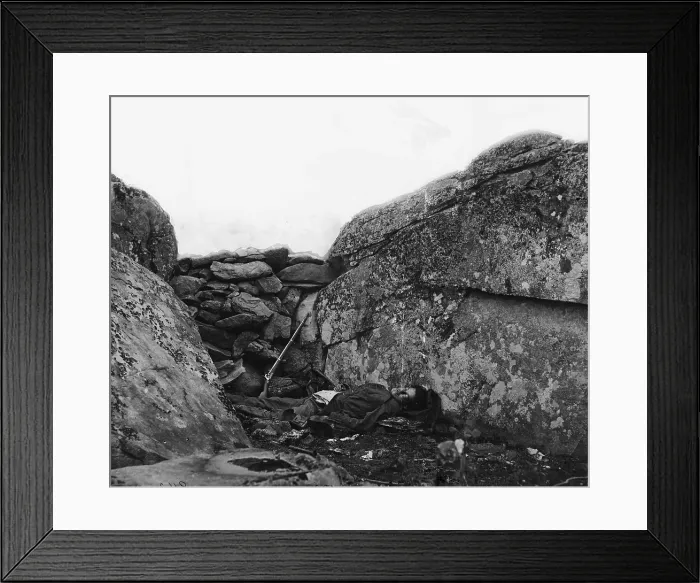 Framed Print : The Civil War. The Battle of Gettysburg. The Home of a Rebel Sharpshooter. A Dead Confederate soldier in Devil's Den, Gettysburg, Pennsylvania. Alex Gardner, 1863 Framed Print : The Civil War. The Battle of Gettysburg. The Home of a Rebel Sharpshooter. A Dead Confederate soldier in Devil's Den, Gettysburg, Pennsylvania. Alex Gardner, 1863