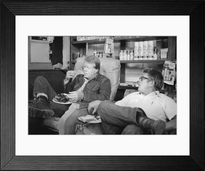 Framed Print : Future President Jimmy Carter, eats with his brother, Billy Carter, during a campaign stop at his brother's gas station in their hometown, Plains, Georgia