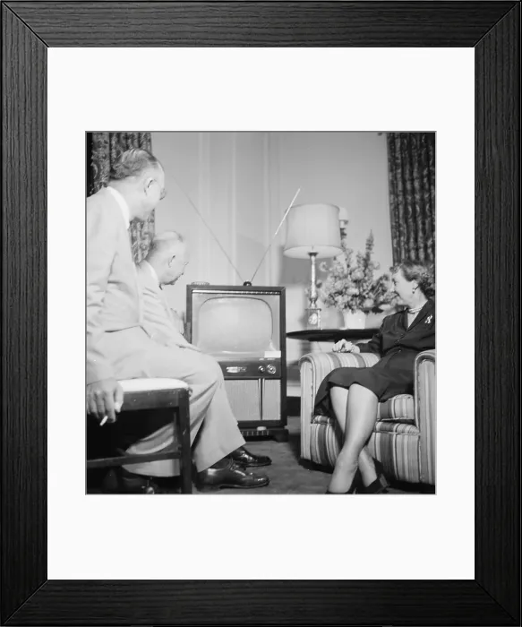 Framed Print : Future President Dwight D. Eisenhower (back left), and future First Lady Mamie Eisenhower, watch the Republican National Convention on television, photograph by Thomas J
