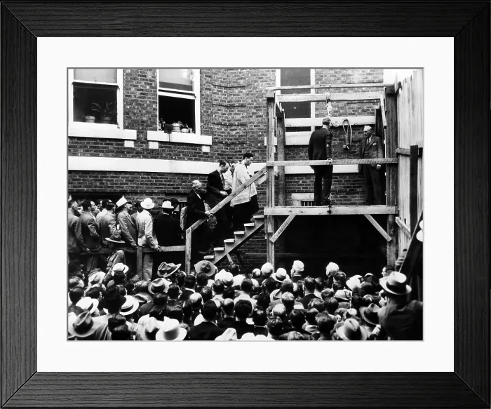 Framed Print : Roscoe Red Jackson (behind priest) walks up the steps before he is hanged. He was convicted of killing a travelling salesman who gave him a ride. Galena, Missouri, 1937