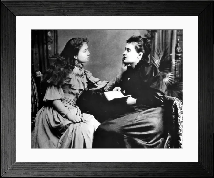 Framed Print : Photo illustrates how Helen Keller (left) hears her instructor, Anne Sullivan by feeling the vibrations of her lips.. Courtesy: CSU Archives  /  Everett Collection