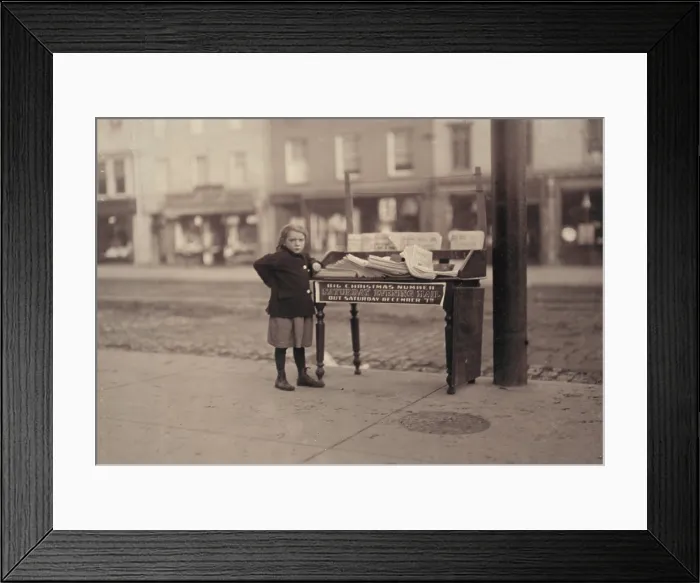 Framed Print : Child labor, Little girl, apparently 6 years old, but didn't know her name or age, tending stand at Washington and 3rd Street, for older sister, saloon on corner, Hoboken
