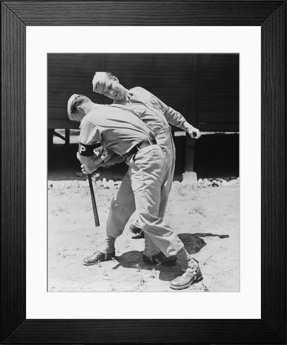 Framed Print : World War II, Private Melvin Kearney, and Military Police Private Elliott Schneiderman (front), practicing disarming a club man, circa 1942