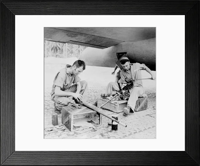 Framed Print : World War II, Sergeant Edward T. Spetch, Sergeant Vernon Nelson, Flying Fortress gunners carefully clean their.50 caliber machine guns at a U.S
