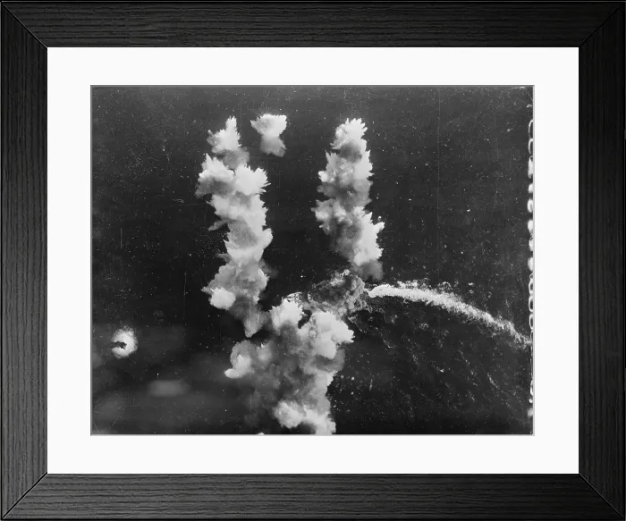 Framed Print : World War II, a direct hit on a 400-foot Italian liner converted into a troop carrier. The hit was made by a Flying Fortress in the Mediterranean Sea, circa 1943 Framed Print : World War II, a direct hit on a 400-foot Italian liner converted into a troop carrier. The hit was made by a Flying Fortress in the Mediterranean Sea, circa 1943