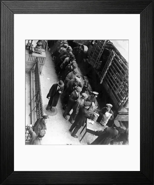 Framed Print : Food handouts in New York in 1930. Police stations were used as distribution centers. Photo shows food being distributed in front of the East 104th Stree station house Framed Print : Food handouts in New York in 1930. Police stations were used as distribution centers. Photo shows food being distributed in front of the East 104th Stree station house