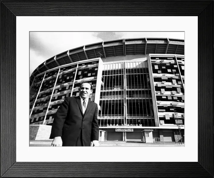 Framed Print : Yogi Berra stands outside Shea Stadium before signing a contract with the New York Mets, 1964. Courtesy: CSU Archives / Everett Collection