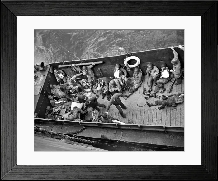 Framed Print : June 6, 1944: A Coast Guard landing barge ties up alongside a Coast Guard-manned invasion transport in the English Channel to transfer wounded American invaders to Framed Print : June 6, 1944: A Coast Guard landing barge ties up alongside a Coast Guard-manned invasion transport in the English Channel to transfer wounded American invaders to