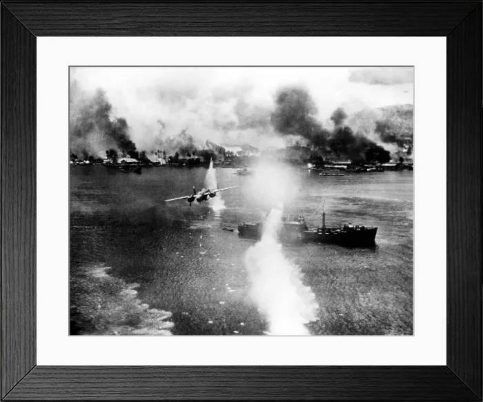 Framed Print : At the Harbor of Rabayl, a bombing of a Japanese ship (in foreground). The white plulme in the center foreground is a waterspout from bomb burst outside the focus of the camera