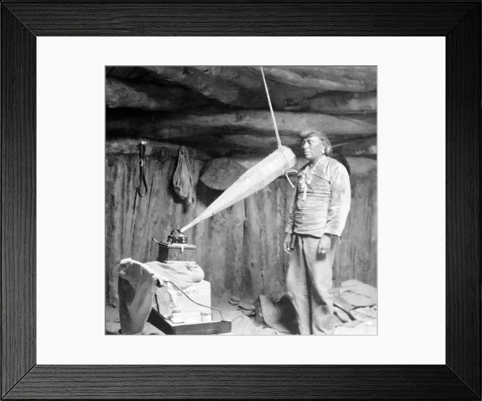 Framed Print : Native American having his voice recorded. Original caption reads: Miguelito, a Navajo from the Southwest, making a voice recording, February 19, 1914