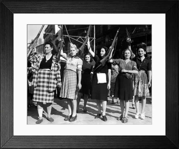 Framed Print : FRANCE--Five women, members of the Maquis, raise the rifles and display the pistols they used to fight the Nazi garrison in Marseille before entry of allied troops