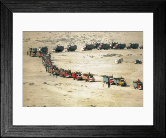Framed Print : MOROCCO. WESTERN SAHARA. Western Sahara (1975). The Green march. Moroccan lorries in the desert. AISA / Everett Collection (81381)**US SALES ONLY**